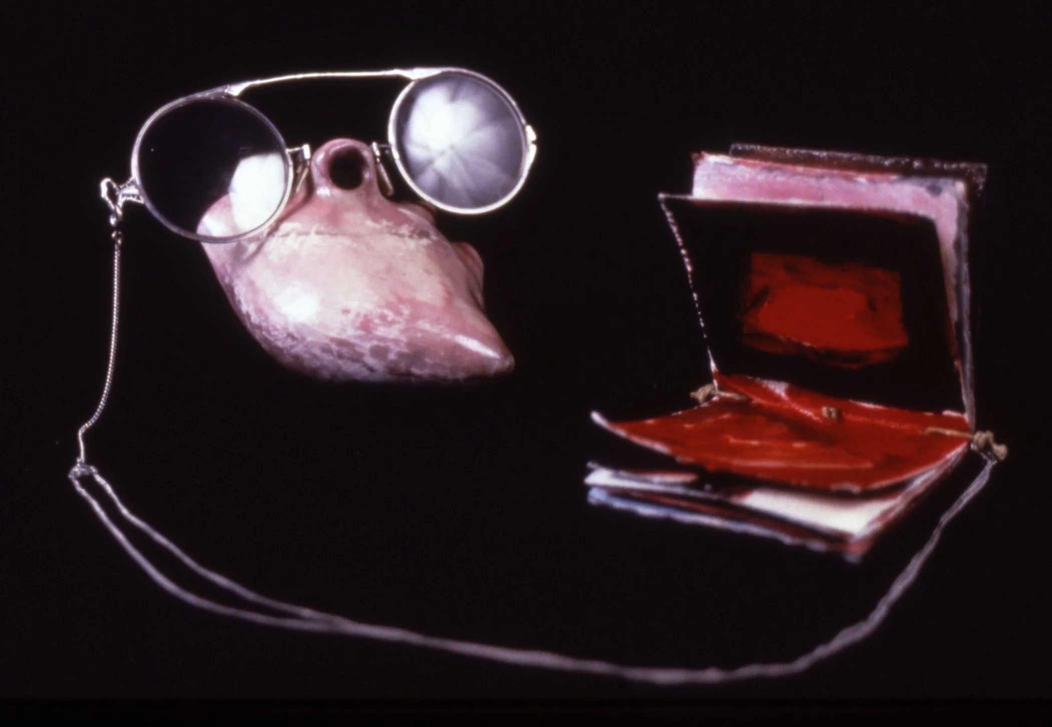 'Historical References', porcelain heart, spectacles, book , 10" x 8" x 8"