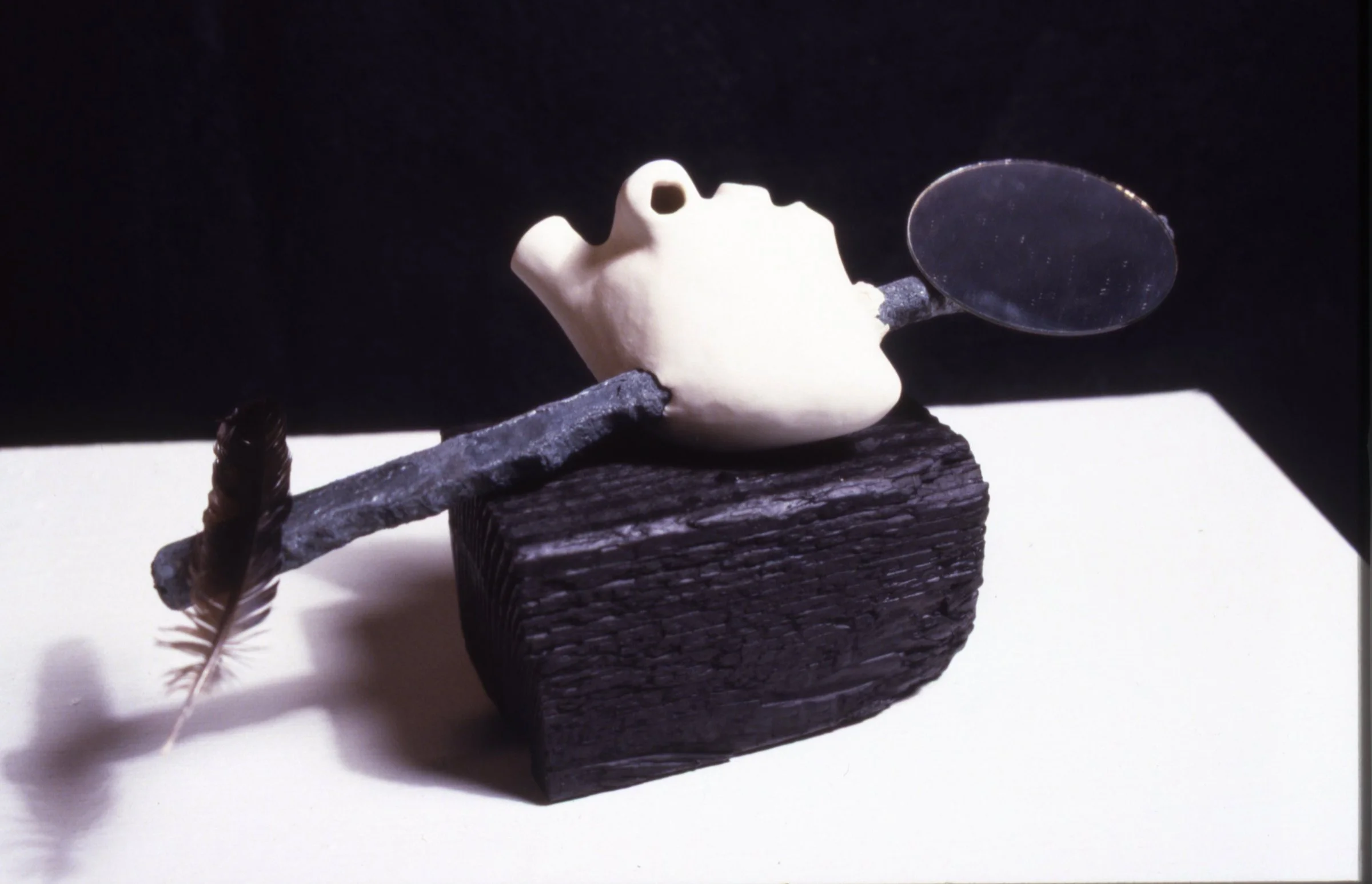 'Bet You', porcelain heart, steel, mirror, feather, wood, 13" x 8" x 7"