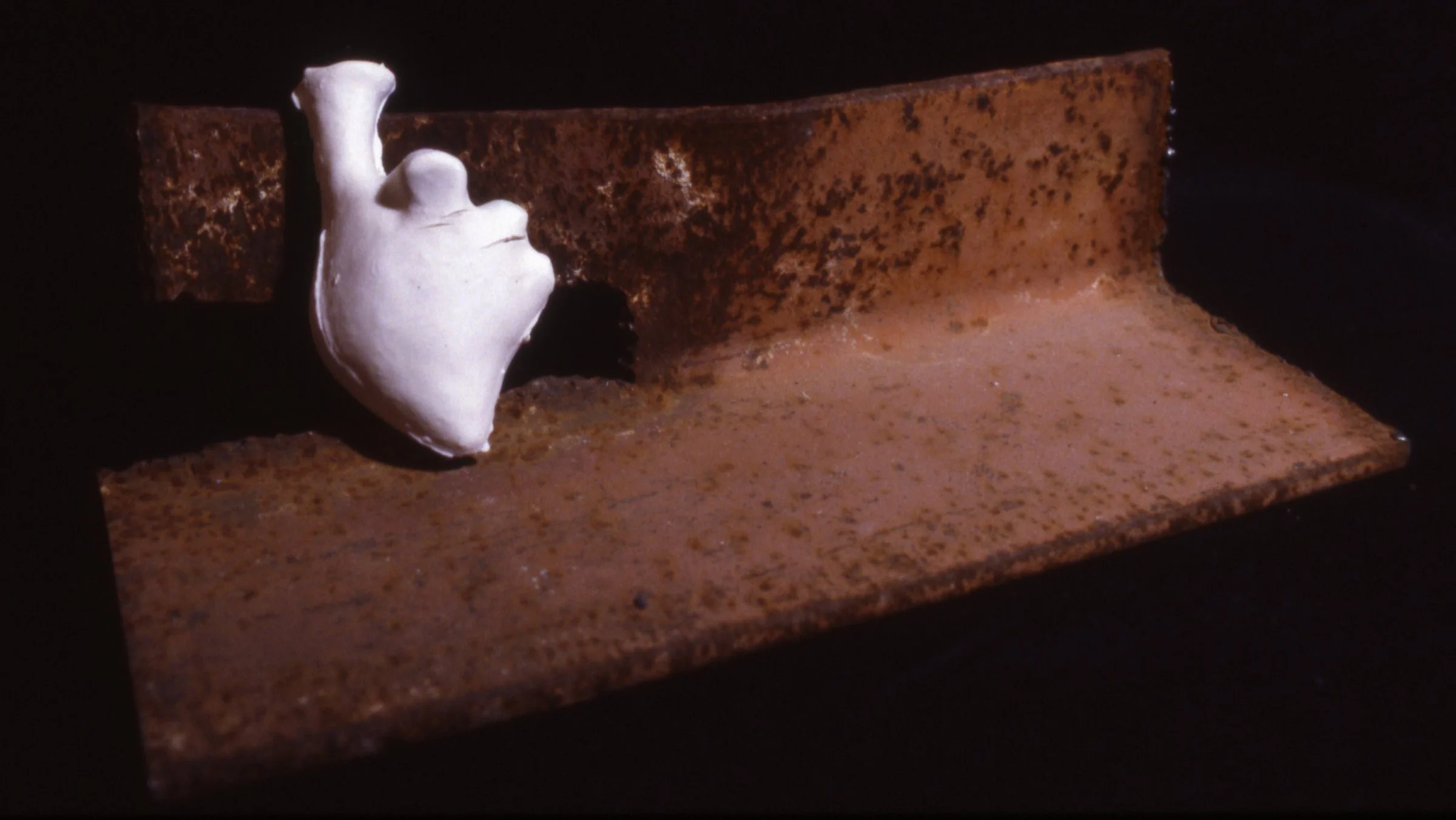 'Heracles', porcelain heart, bent iron, 14" x 6" x 7"