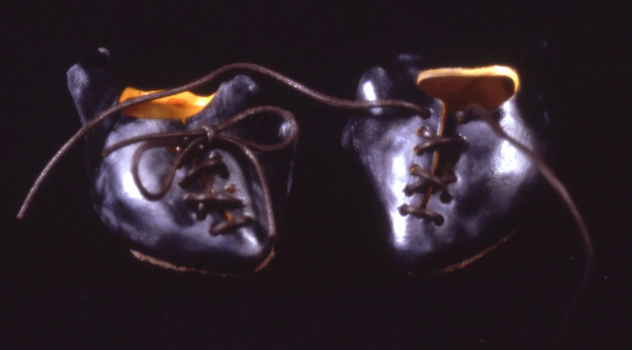 'Philo', 2 porcelain heart shoes, leather,  9" x 4" x 5"