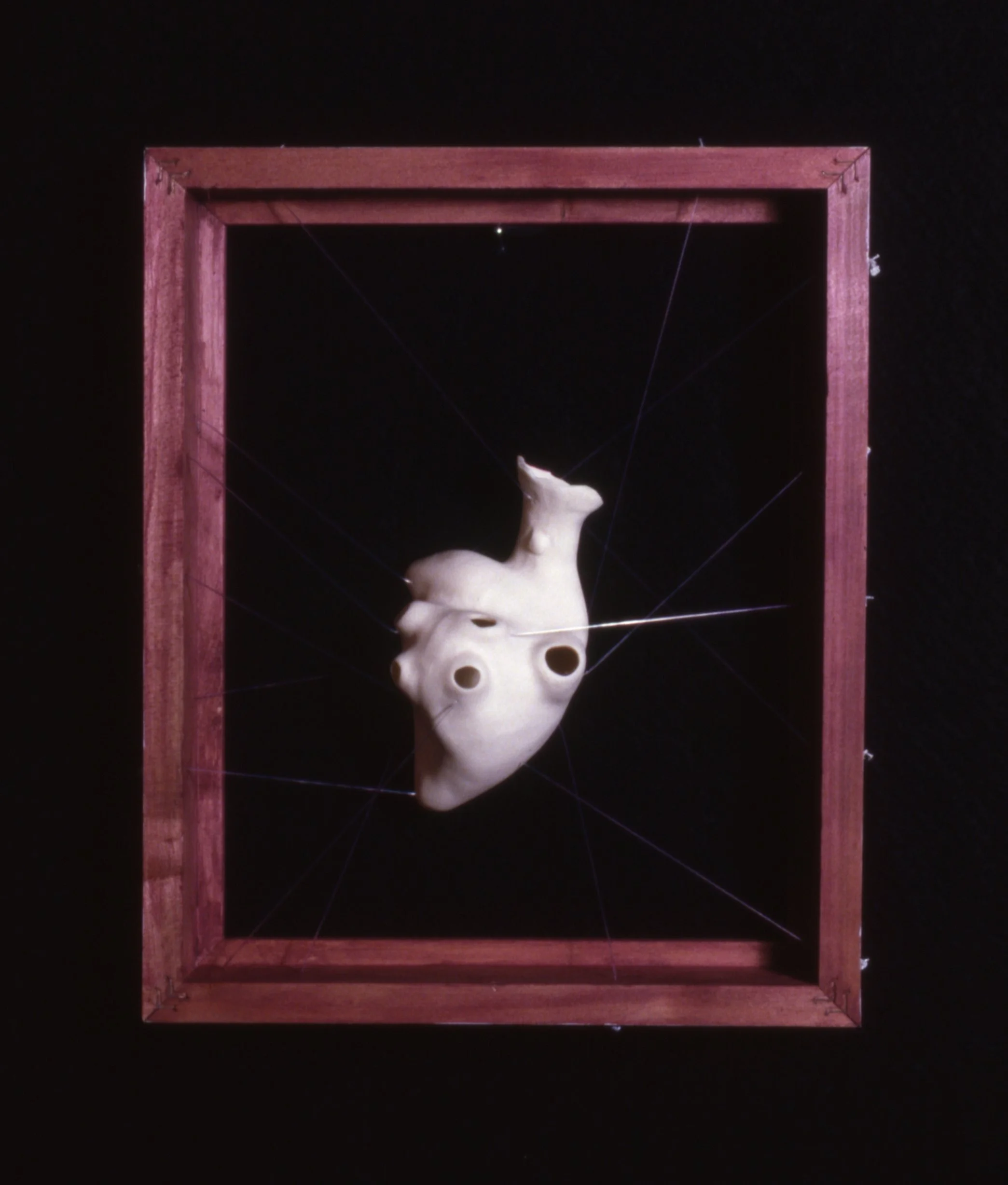 'Tendency', porcelain heart, filament, wood, 8" x 10" x 4"