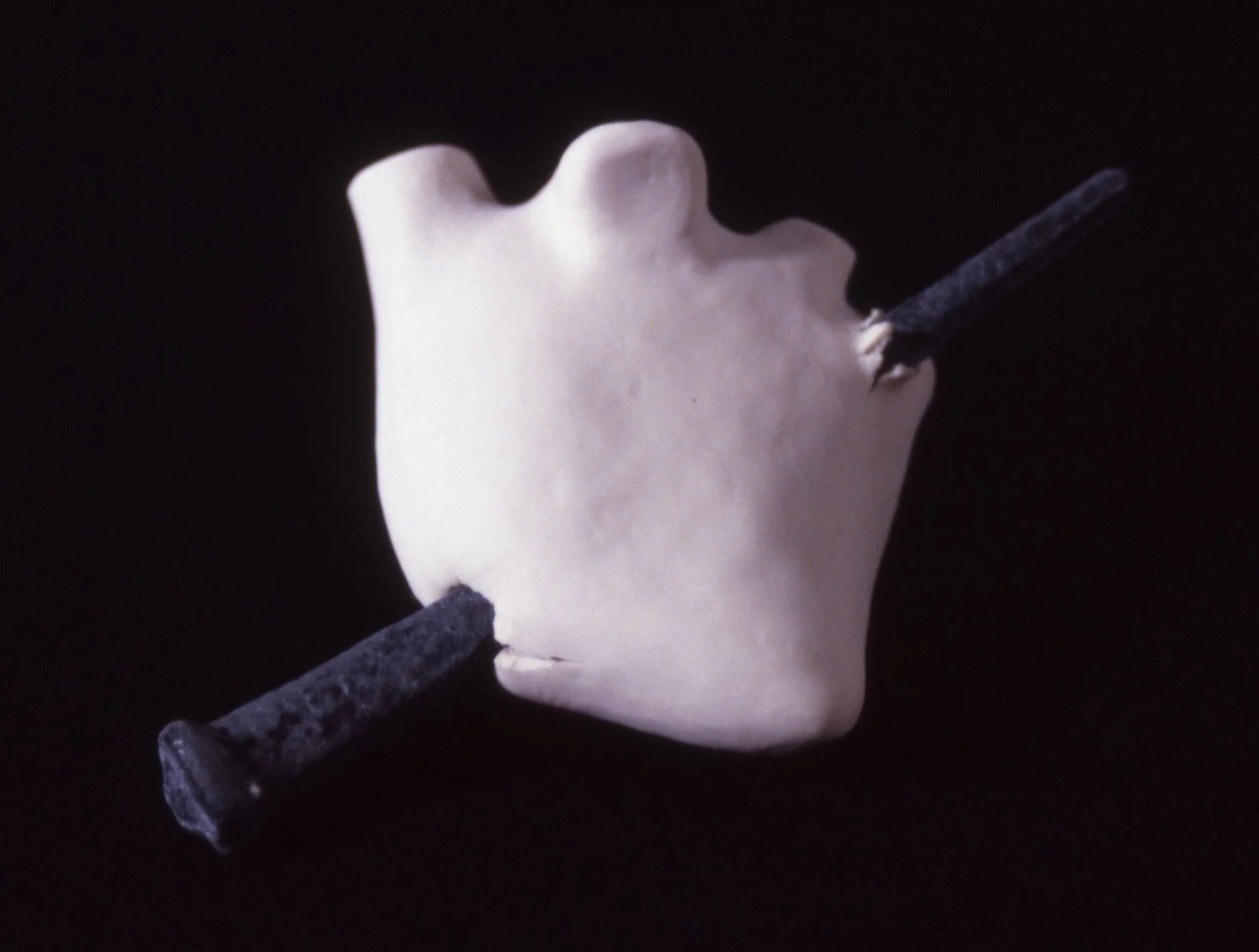 'Eros Stricken', porcelain heart, iron nail, 6" x 3" x 3"