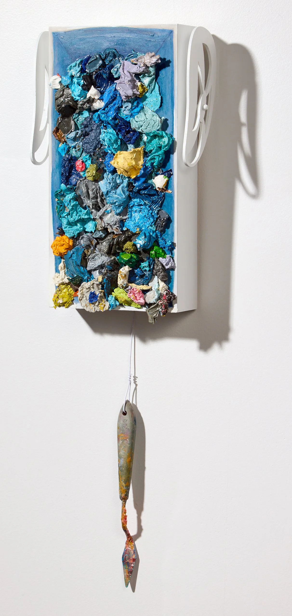 'Spare Ribs', painting, quarter view, 7" x 25" x 4, oil + oil paint fragments on wood, palette knife, hook up wire, 2026