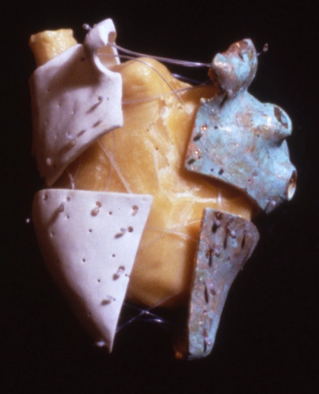 'Achilleus', split porcelain heart, bees wax,, filament, 6" x 7" x 6"