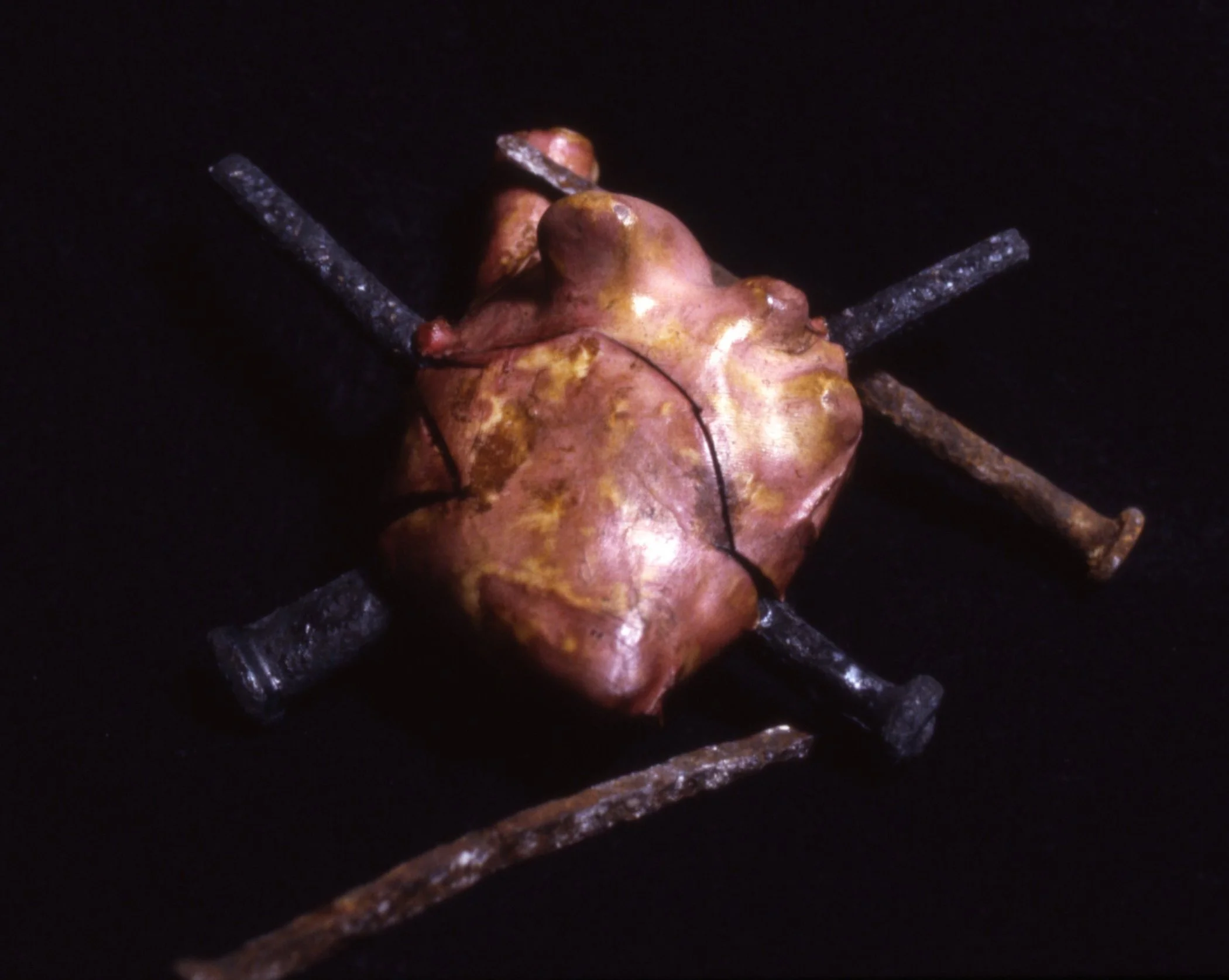 'Wounded', porcelain heart, iron nails 6" x 6" x 4"