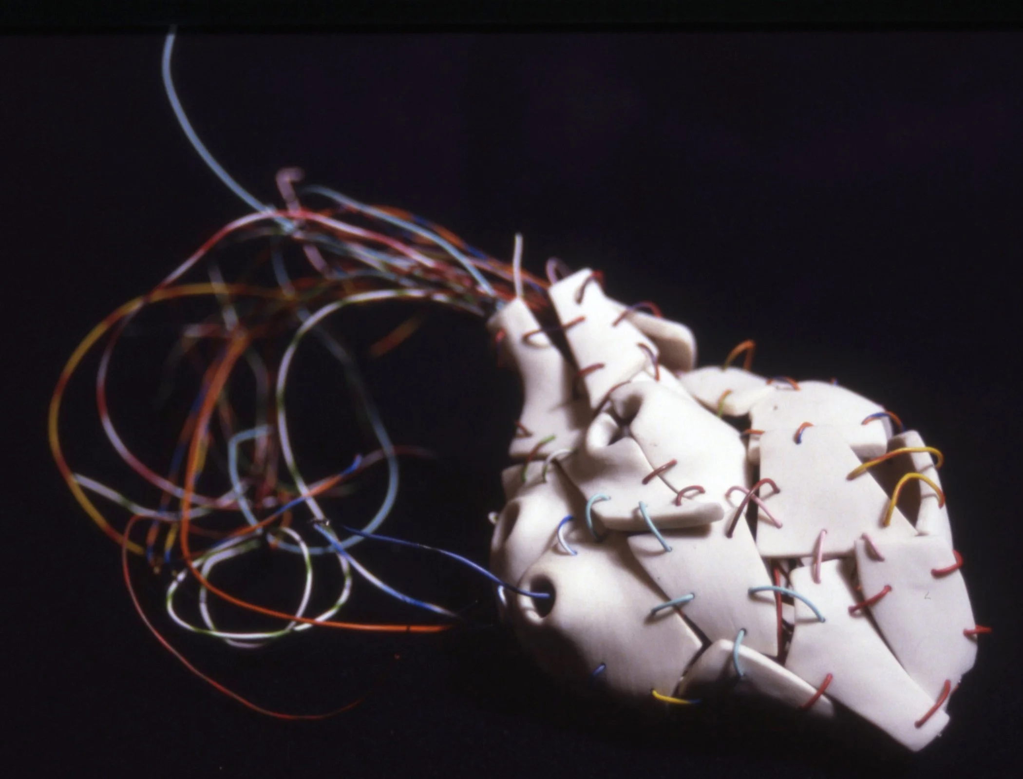 'Connection', segmented porcelain heart, hook up wire 4" x 7" x 4"