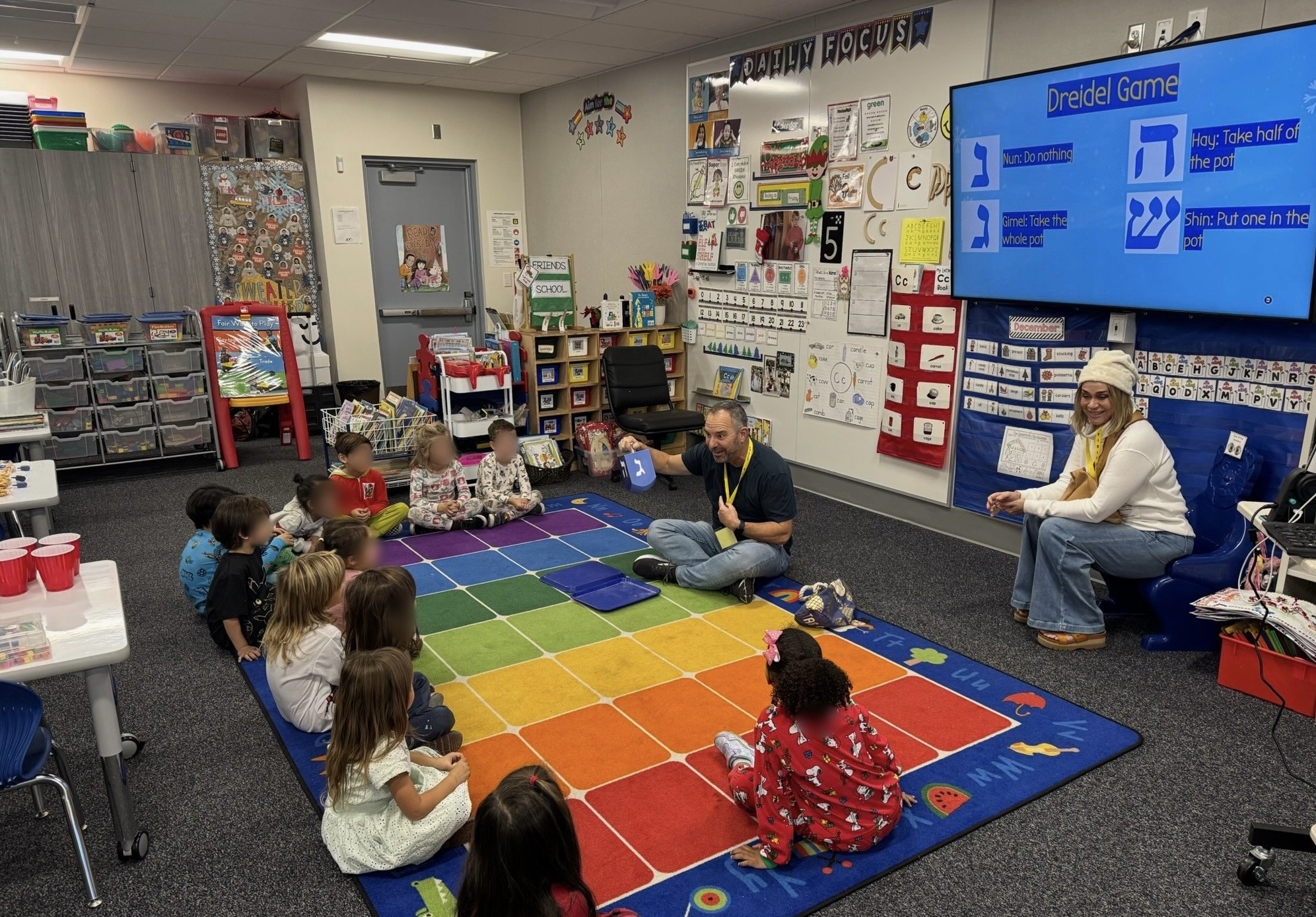 A special moment when my mom and dad visited my class to teach my students how to play dreidel for Hanukkah.