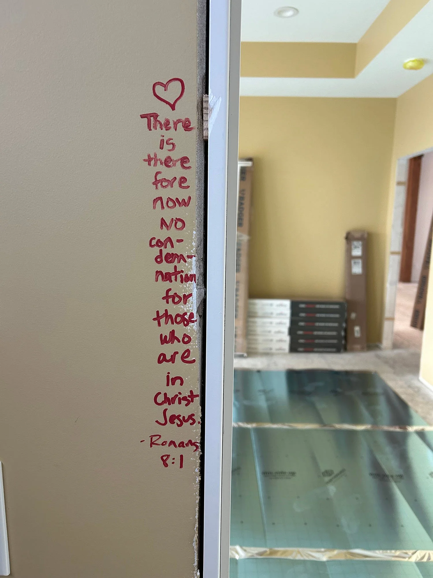 Bible verse handwritten vertically beside a doorway during construction of our home.