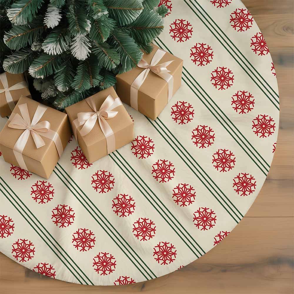 Cream Christmas tree skirt with red snowflake motifs and narrow green stripes beneath a tree with wrapped gifts.