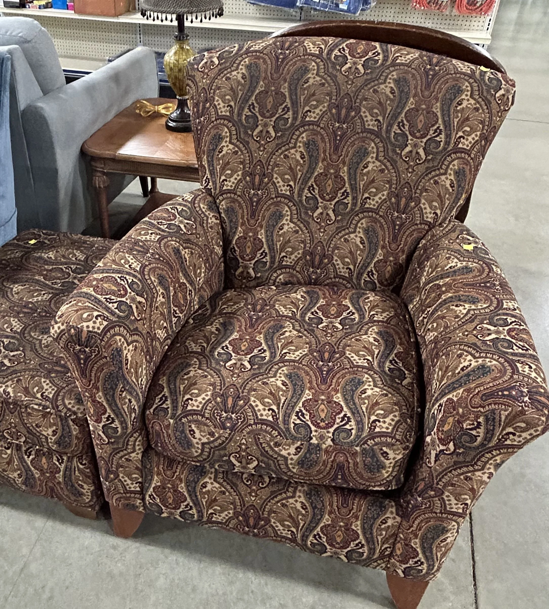Vintage chair from Habitat ReStore awaiting reupholstery as part of the home's ongoing decorating journey.