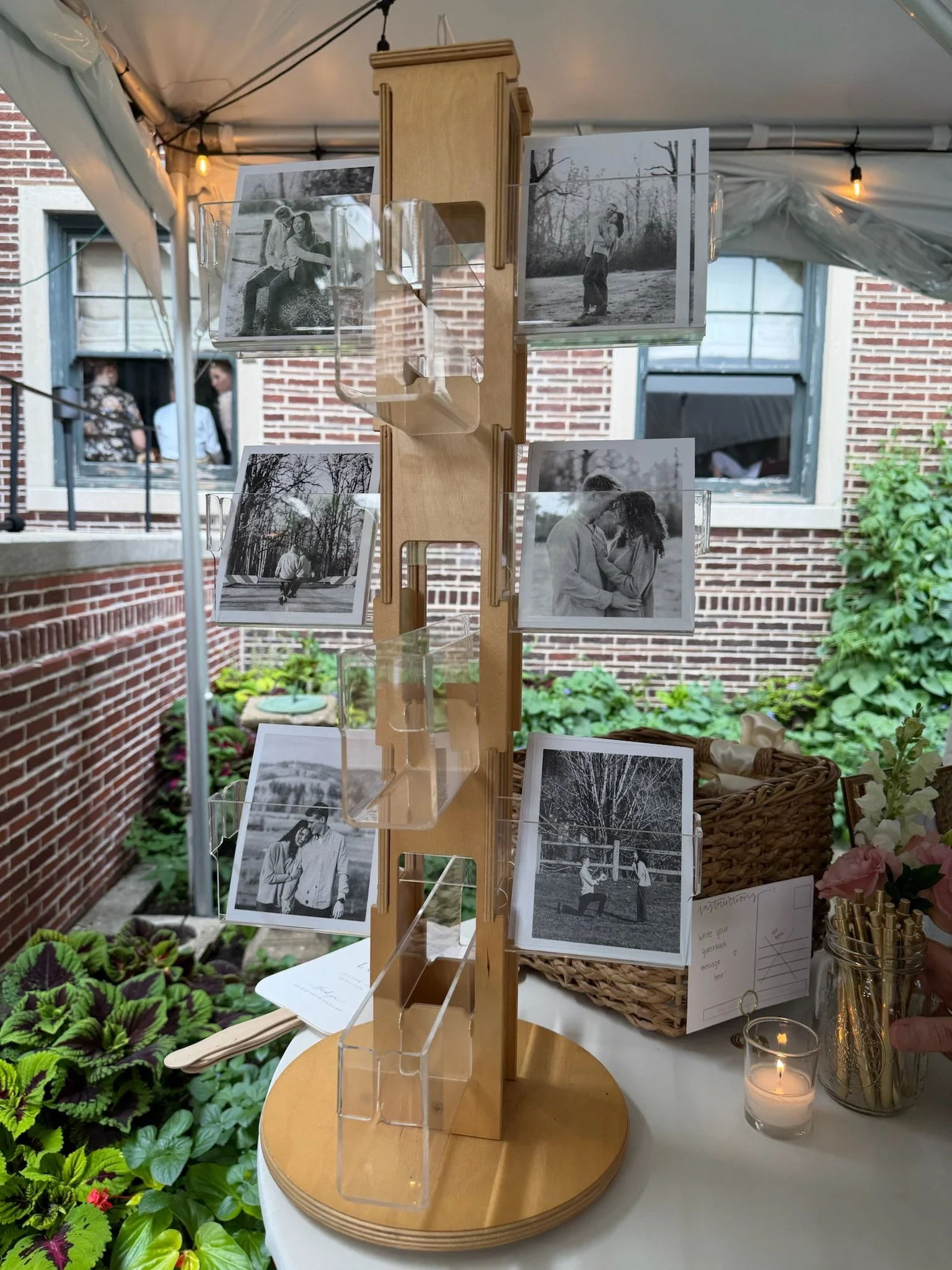 Wedding guest postcard display featuring engagement photographs and postcards for guests to write encouraging messages to the newlyweds.