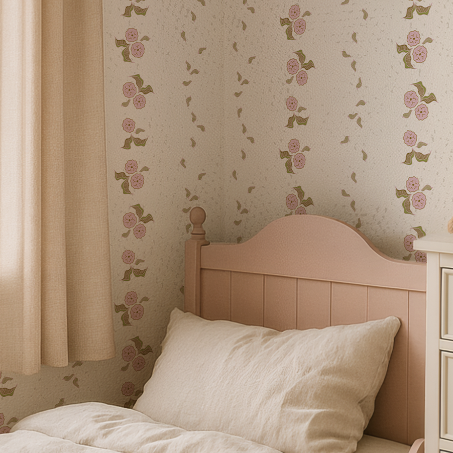 Soft pink floral wallpaper from the Sweet Girl Collection styled in a vintage-inspired child’s bedroom with blush headboard and cream bedding.
