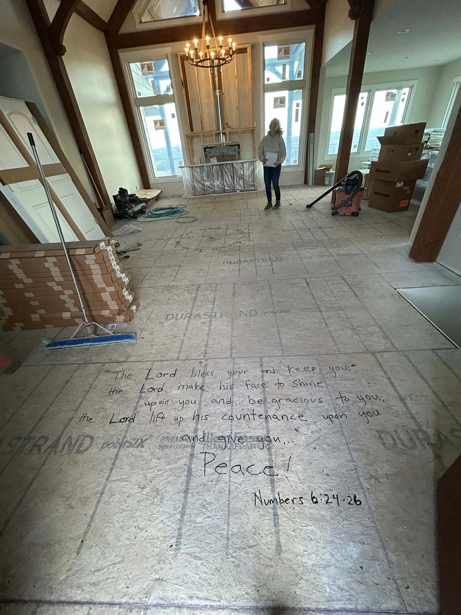 Numbers 6:24–26 handwritten on the subfloor of our great room while our home was under construction.