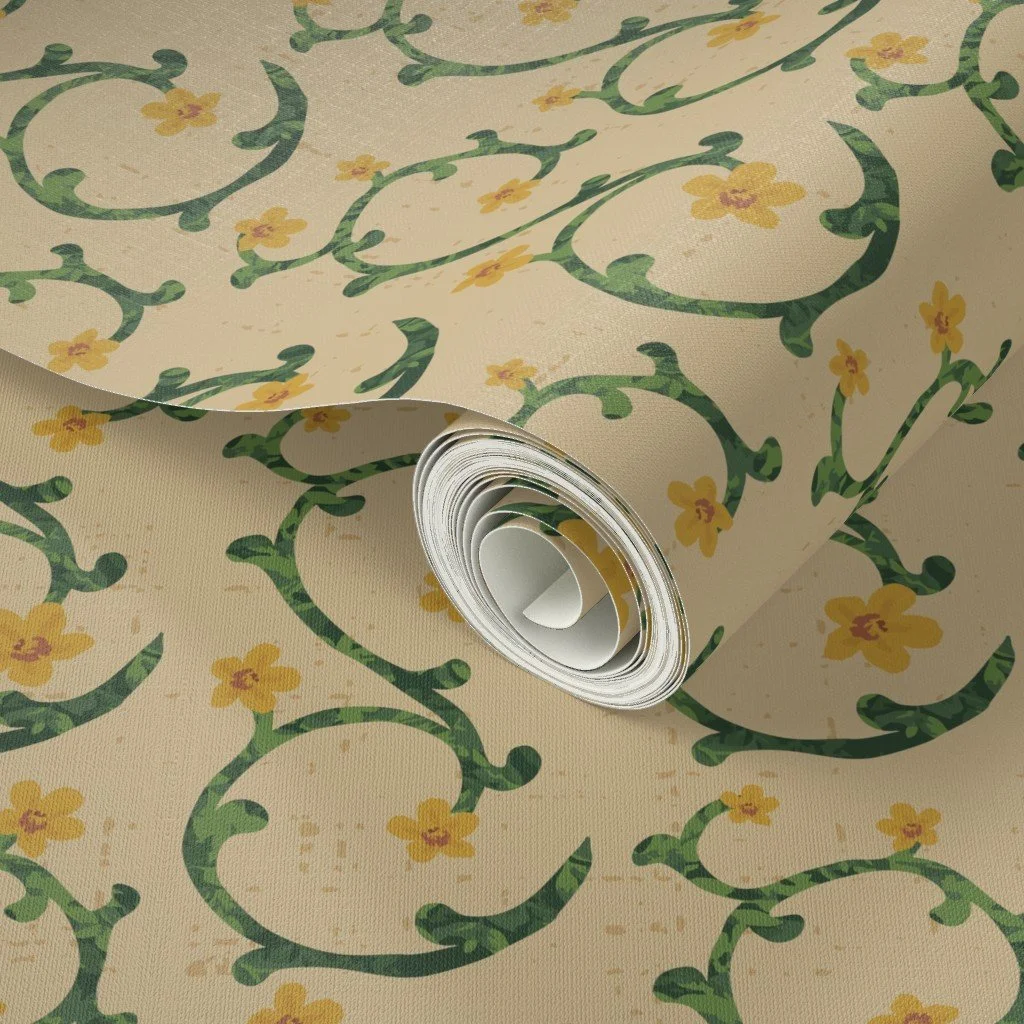 Rolled wallpaper showing floral vine pattern with green scrollwork and small yellow flowers on textured beige