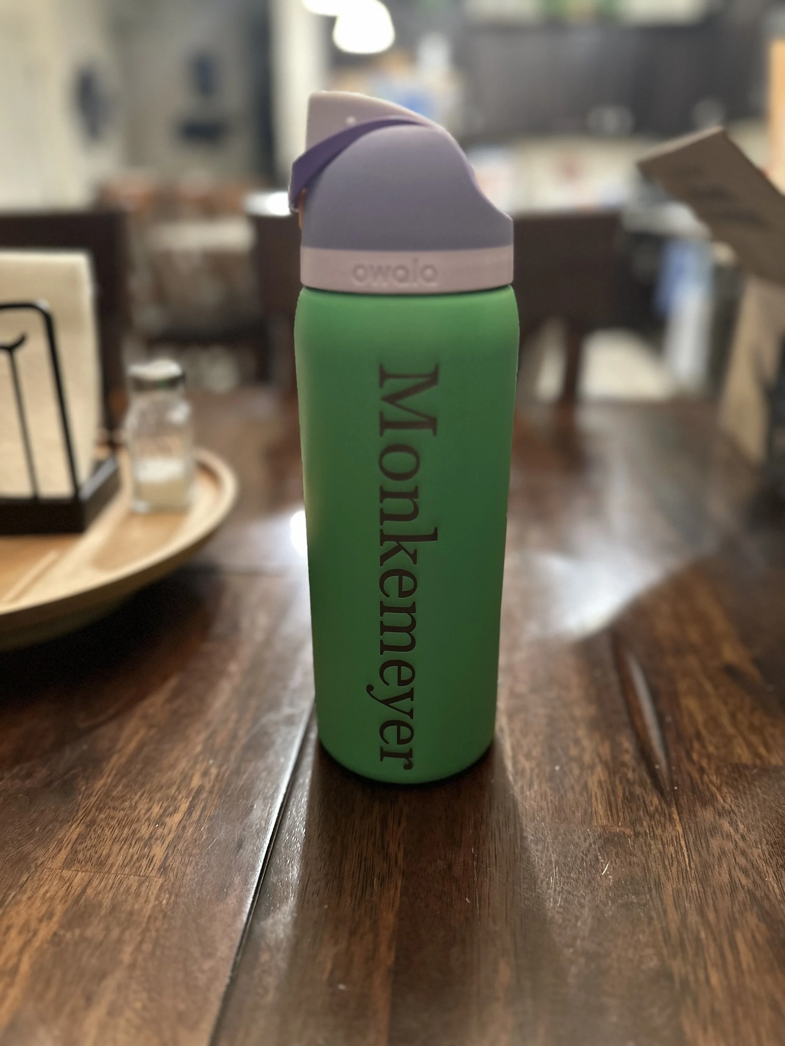 A green laser engraved water bottle