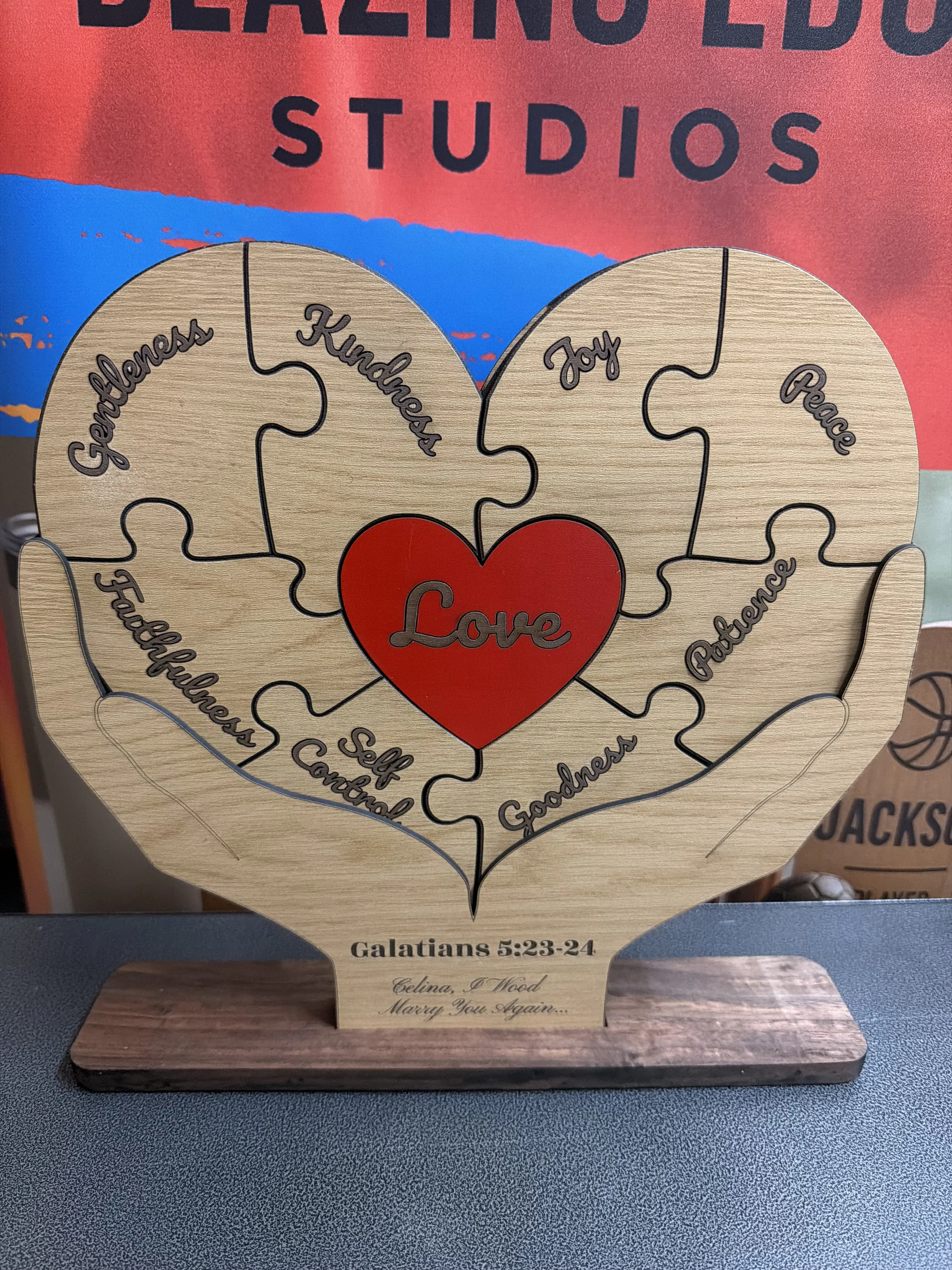 A bespoke anniversary gift featuring the Fruits of the Spirit from Galations, this puzzle is comes out of the hands holding stand and disassembles into a puzzle that is held magnetically to the back. 