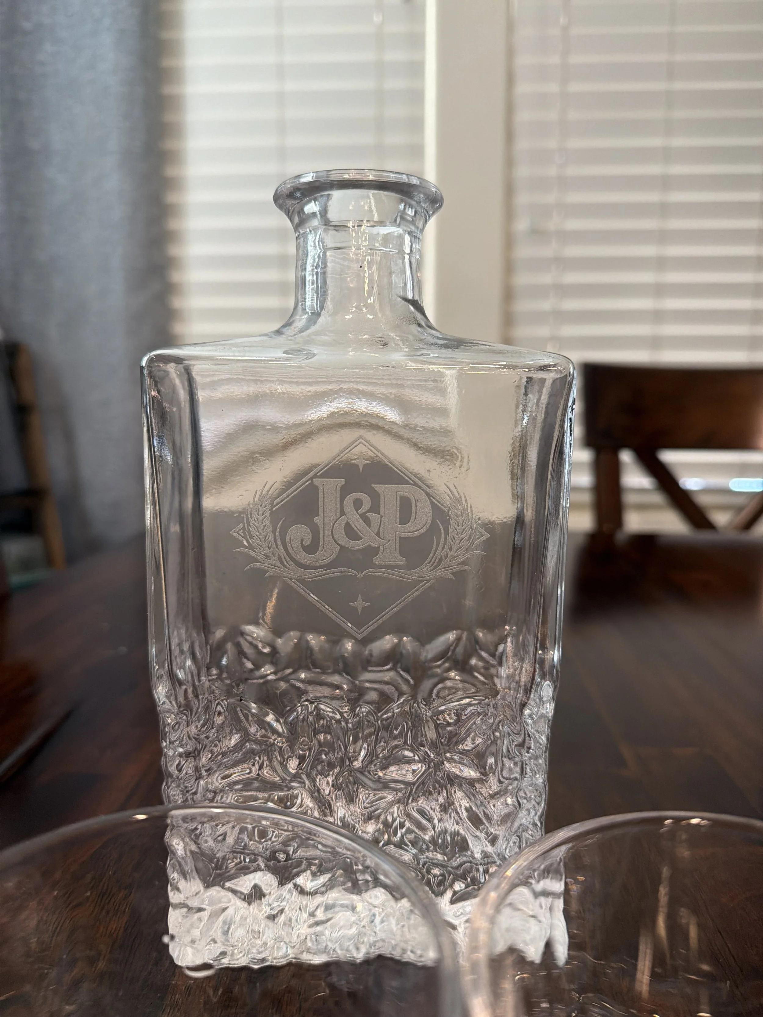 Whiskey decanter featuring the recipient's first initials in a custom logo designed to evoke an old time bourbon brand