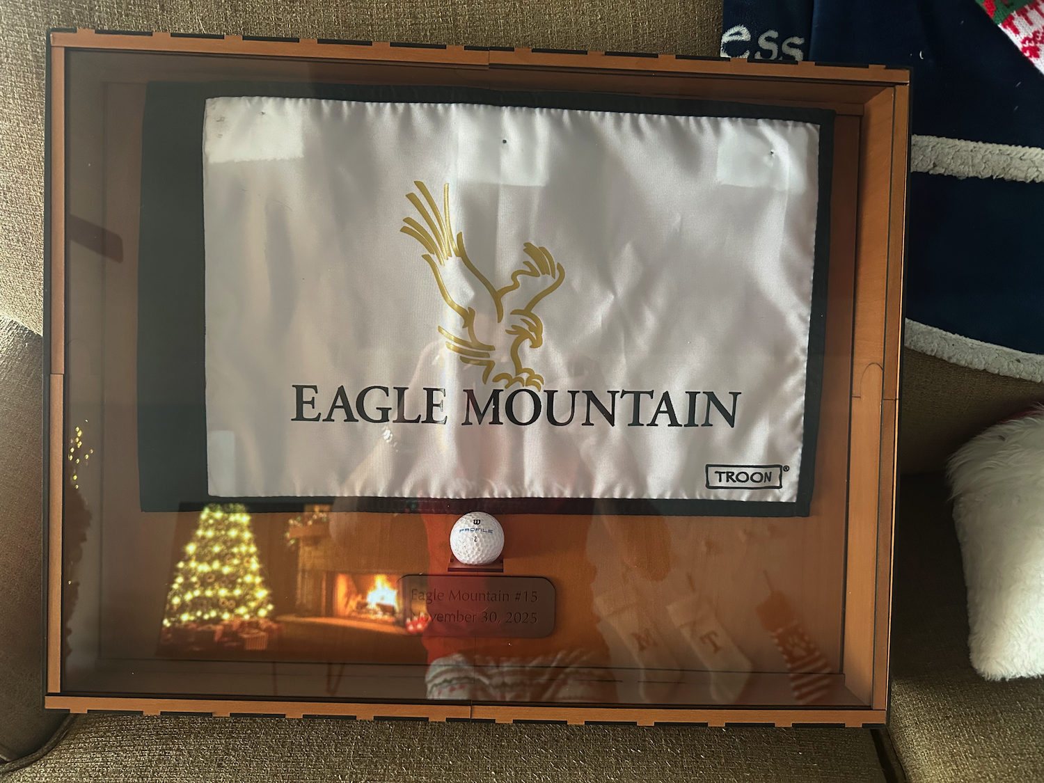 This bespoke display case was built to showcase the owner's first hole-in-one, and features a flag from the golf course, the ball used for the ace, and a plaque commemorating the date and location.