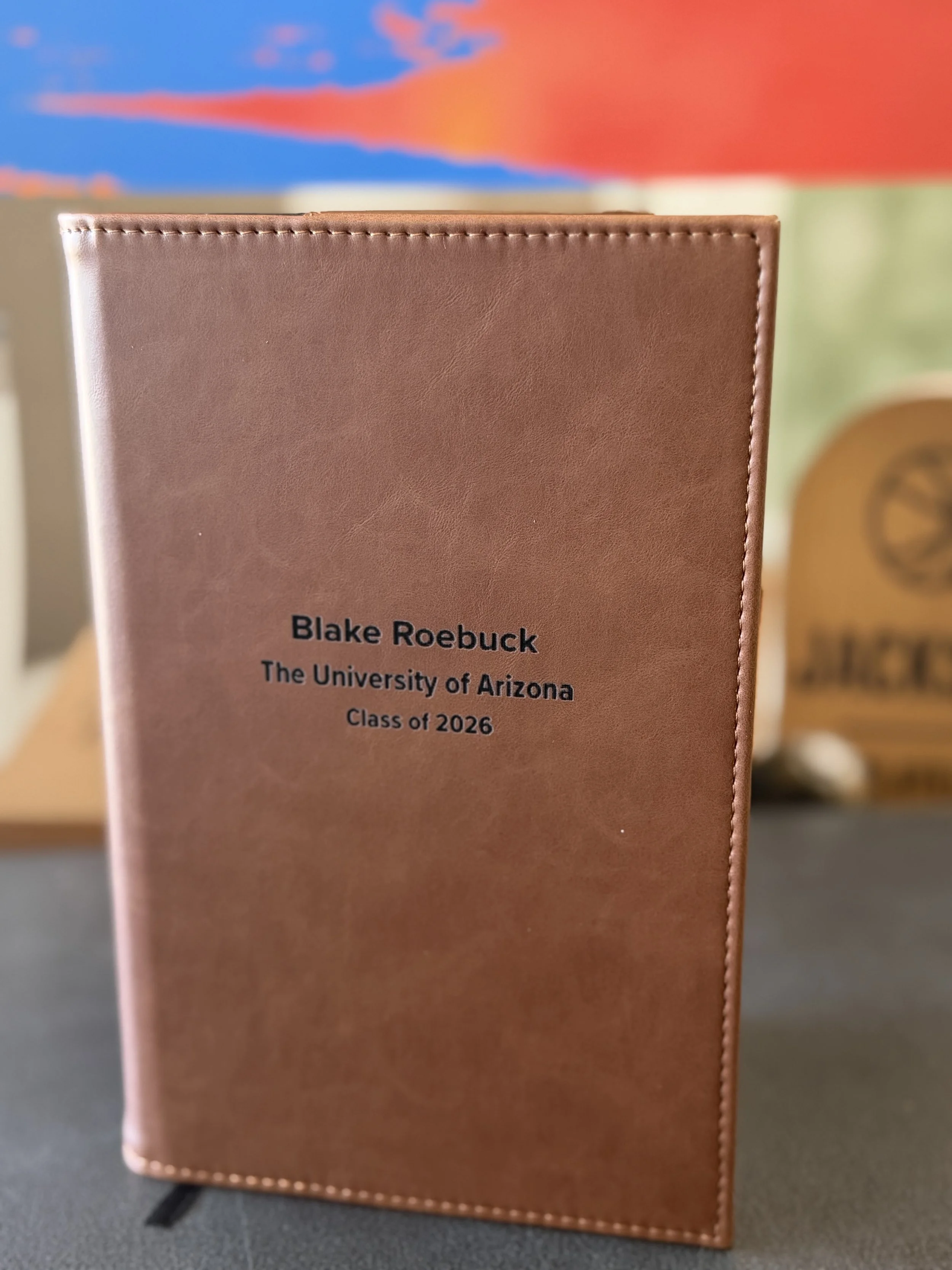 An engraved brown leatherette journal