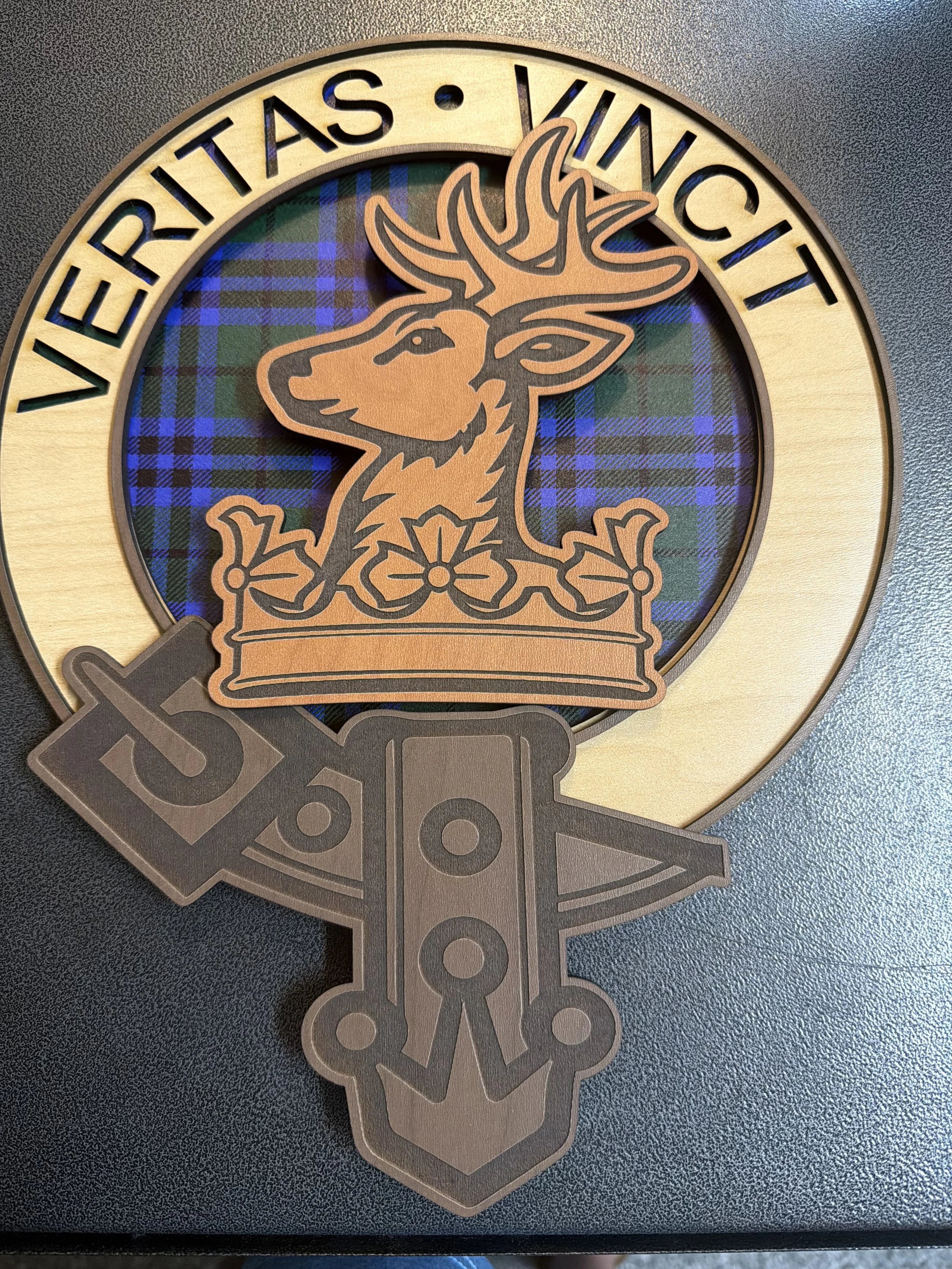 A bespoke multi layered piece for Clan Keith features wood custom printed with the clan tartan and the clan crest in oak, cherry and walnut.