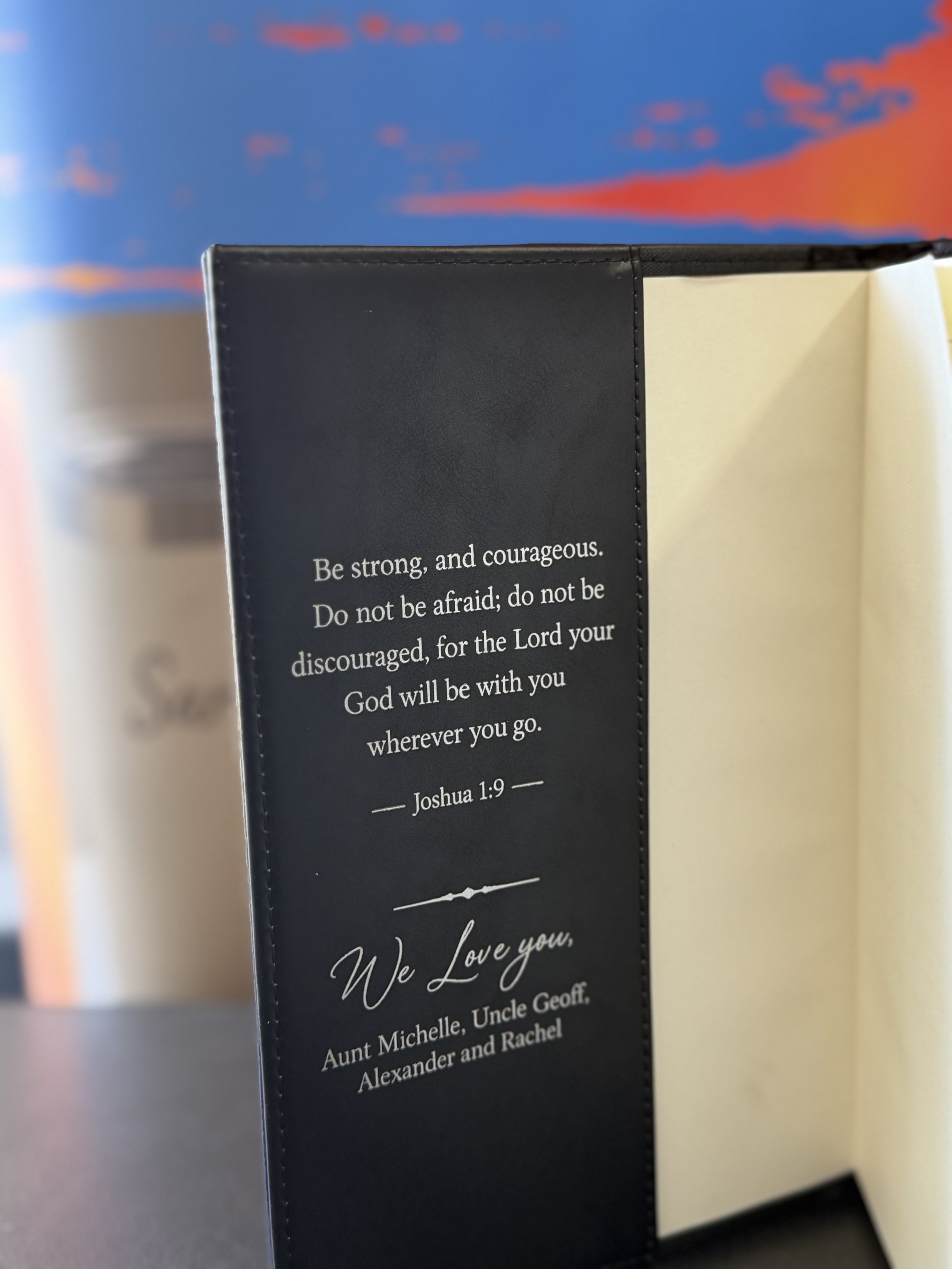 An engraved black leatherette journal