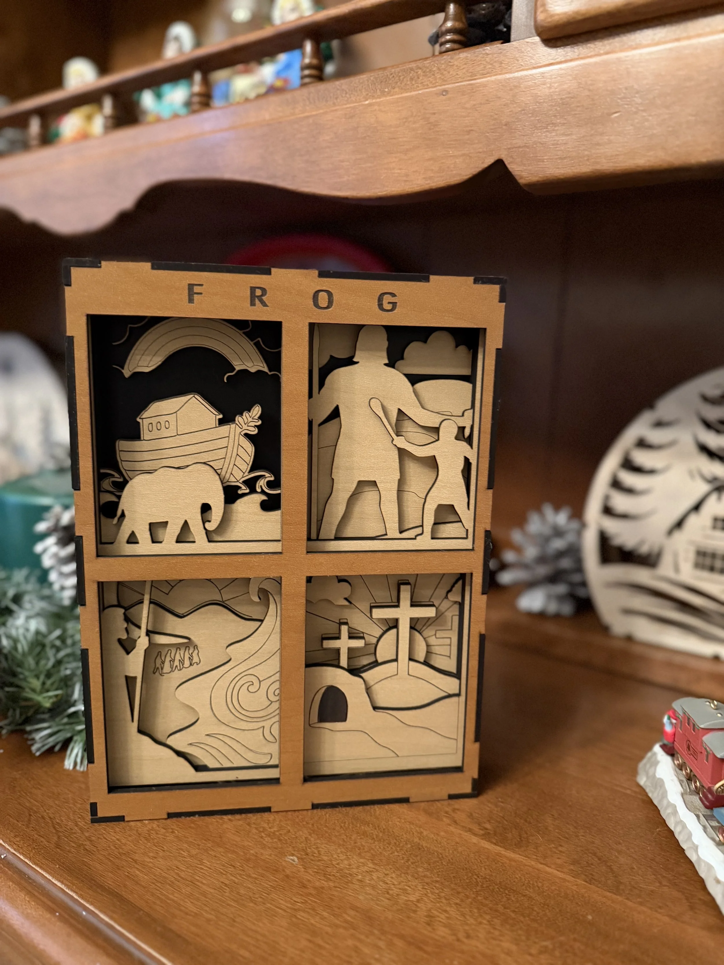 This bespoke shadow box features four famous stories from the Bible and the customer's grand daughter's favorite slogan FROG for Fully Rely Upon God