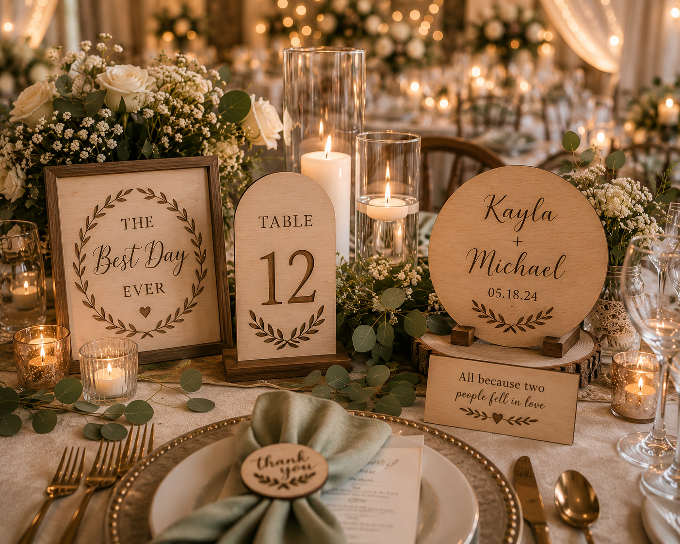 Decorative wedding table centerpiece with wooden signs, candles, flowers, and greenery, including a sign with the names Kayla and Michael, and date 05.18.24.