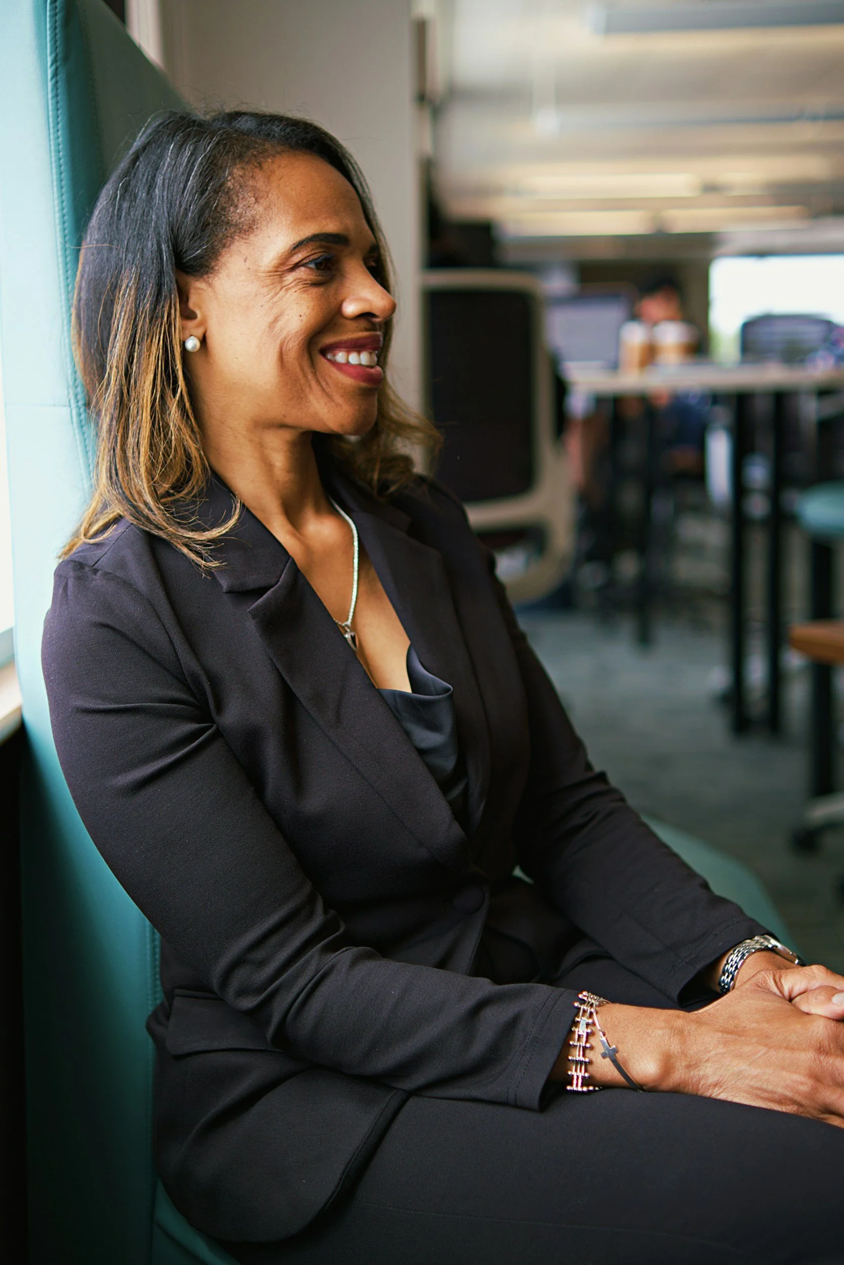 Marvern Ventures team member smiling in a modern office, part of the team supporting real estate investors nationwide.