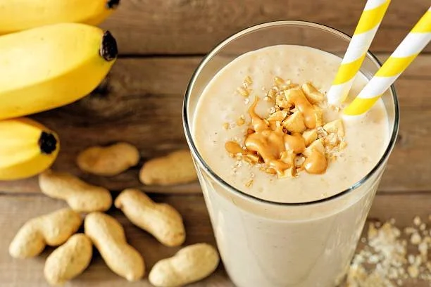A creamy peanut butter and banana protein shake in a tall glass, showing a high-protein smoothie ideal for weight loss and muscle support.