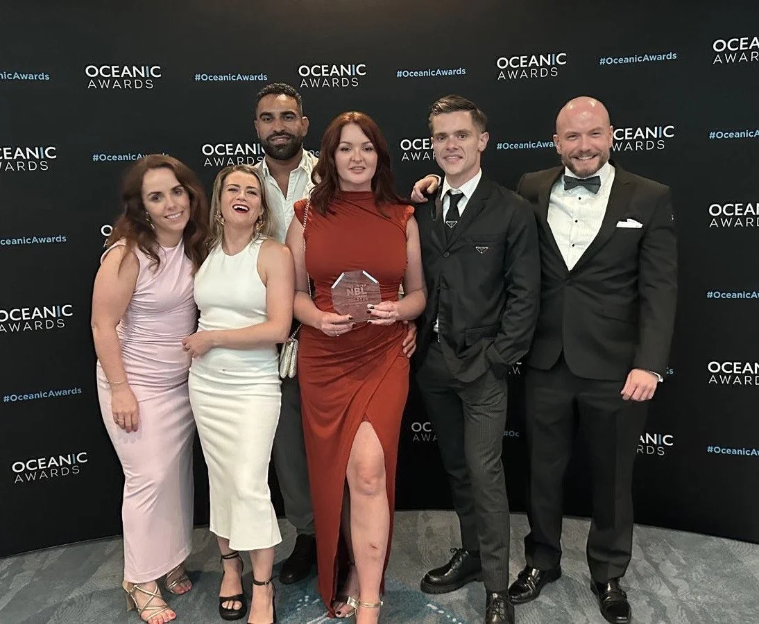 Brows By Lue team proudly posing with their award, celebrating excellence in beauty treatments