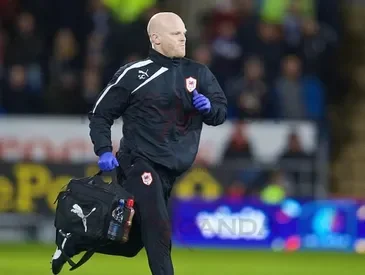 Sean Connelley running across a football / soccer field