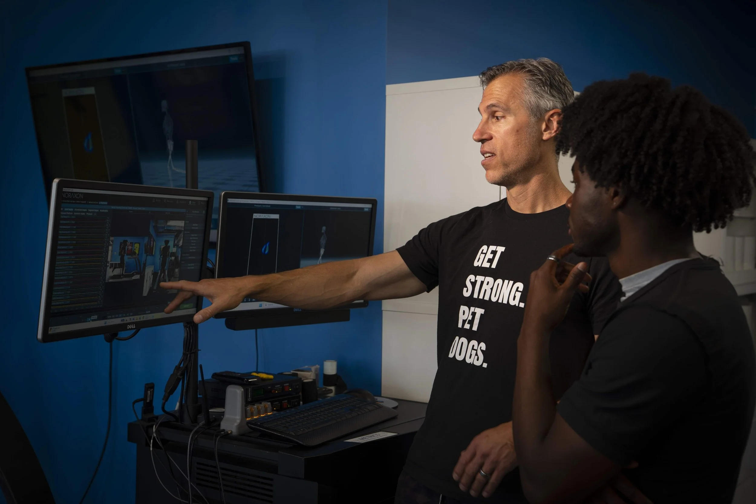 Sports chiropractor evaluating a patient's movement and injury in Denver