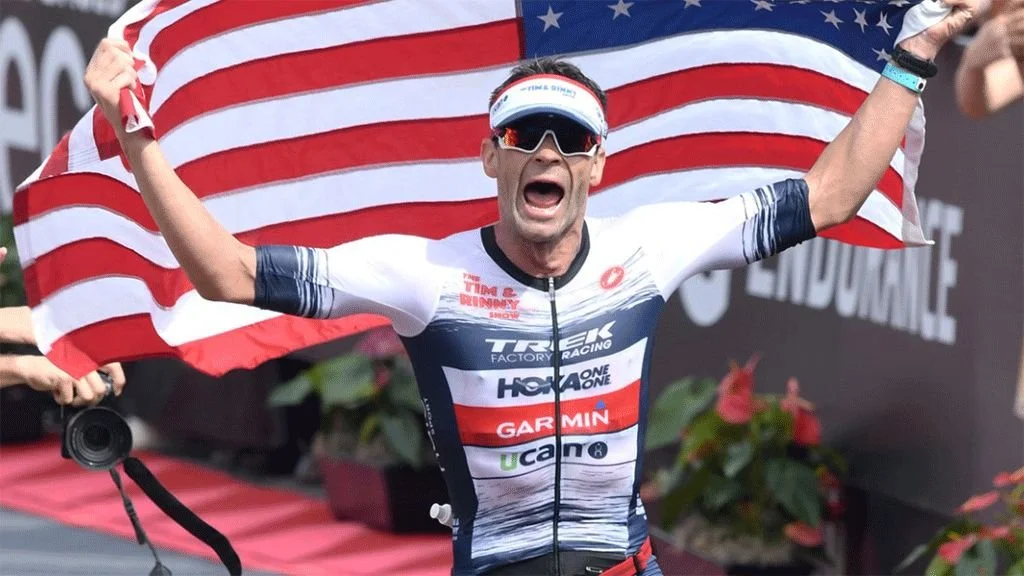 Tim O'Donnell running with an American flag