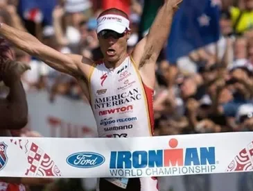 Craig Alexandar crossing the Ironman World Championship finish line