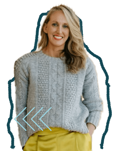 A woman with blonde hair smiling, wearing a light gray sweater and yellow pants, standing against a plain background.