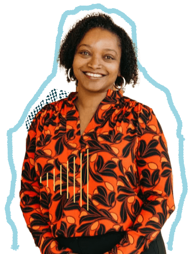A woman smiling, wearing a red and black patterned blouse, with curly hair and hoop earrings.