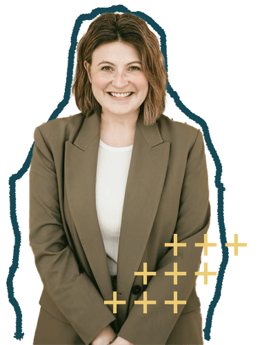 A smiling woman with shoulder-length brown hair, dressed in a beige blazer and white top, standing against a black background with gold plus signs.