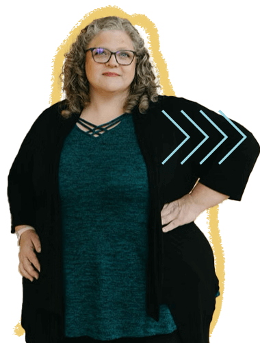 A woman with curly hair, glasses, wearing a teal top and black cardigan, holding a black folder with blue chevron patterns, standing confidently with one hand on her hip.