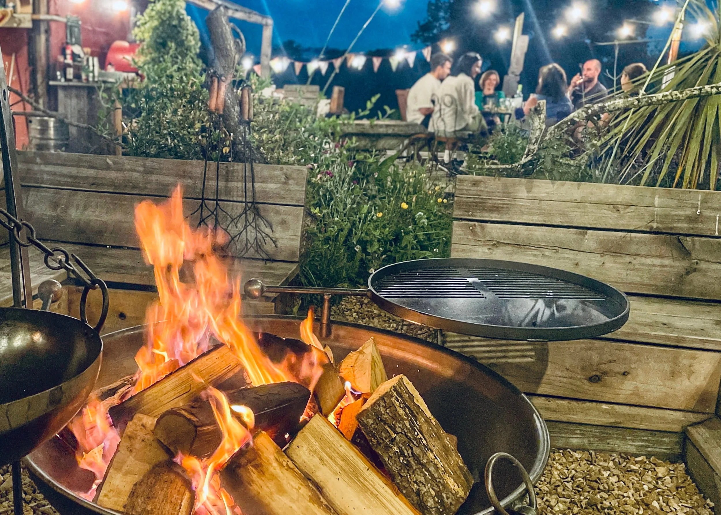 a family gathering near a fire pit