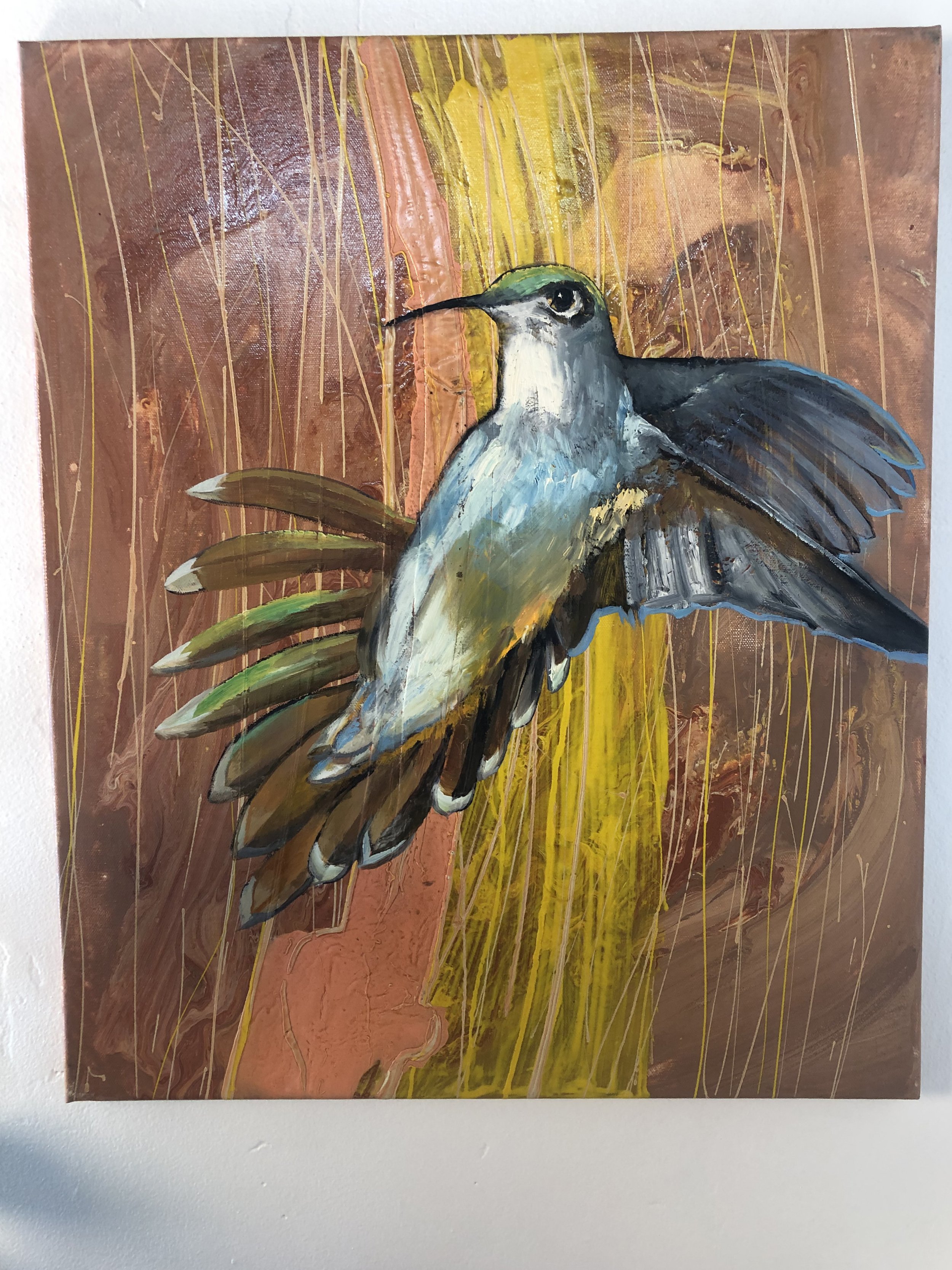 Colorful abstract painting of a hummingbird with a textured background of browns, yellows, and light streaks.