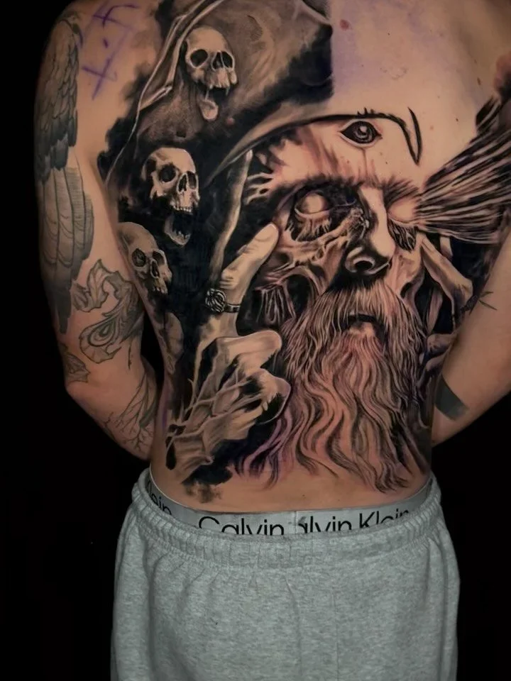 Pirate themed back piece Still in progress, but this piece is already speaking loud.
Death, time, and perception colliding &mdash; layered realism with heavy contrast and movement from shoulder to spine. 🕯️💀

Long sessions, deep blacks, and detail 