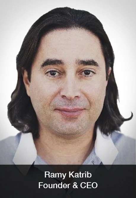 Portrait of Ramy Katrib, Founder and CEO, with shoulder-length dark hair, wearing a light-colored shirt.