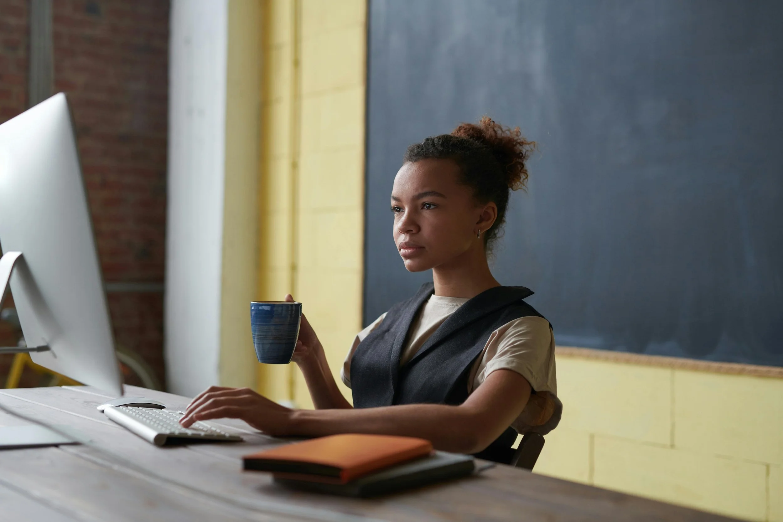 Teacher looking at a computer screen