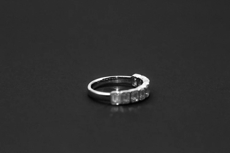 Gold band with nine initials engraved inside
