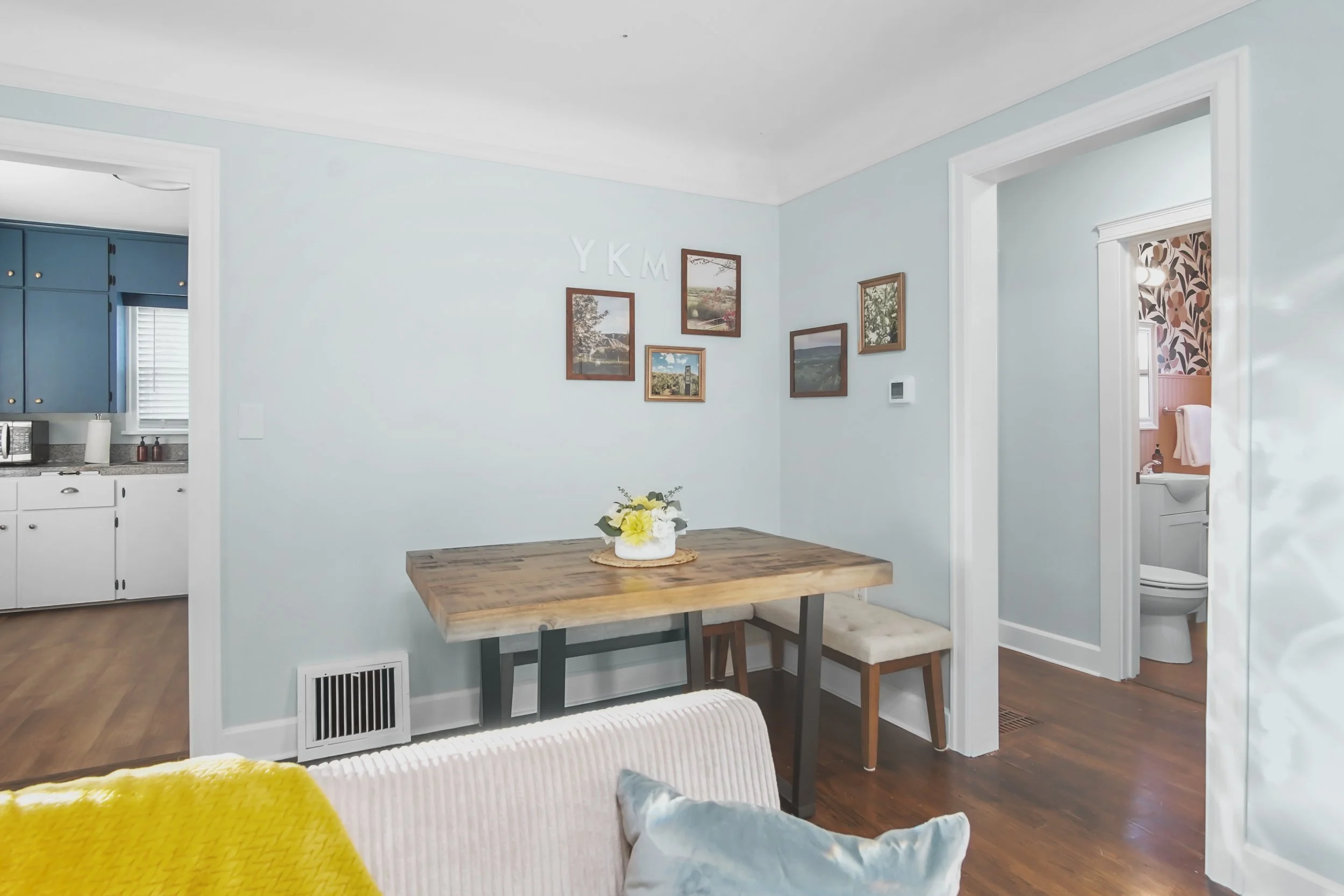 A cozy corner with local photography of the canyon and blooms