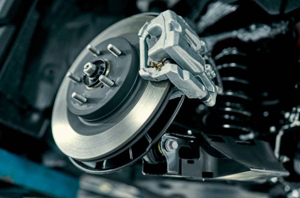 Close-up of a car disc brake system with caliper and rotor.