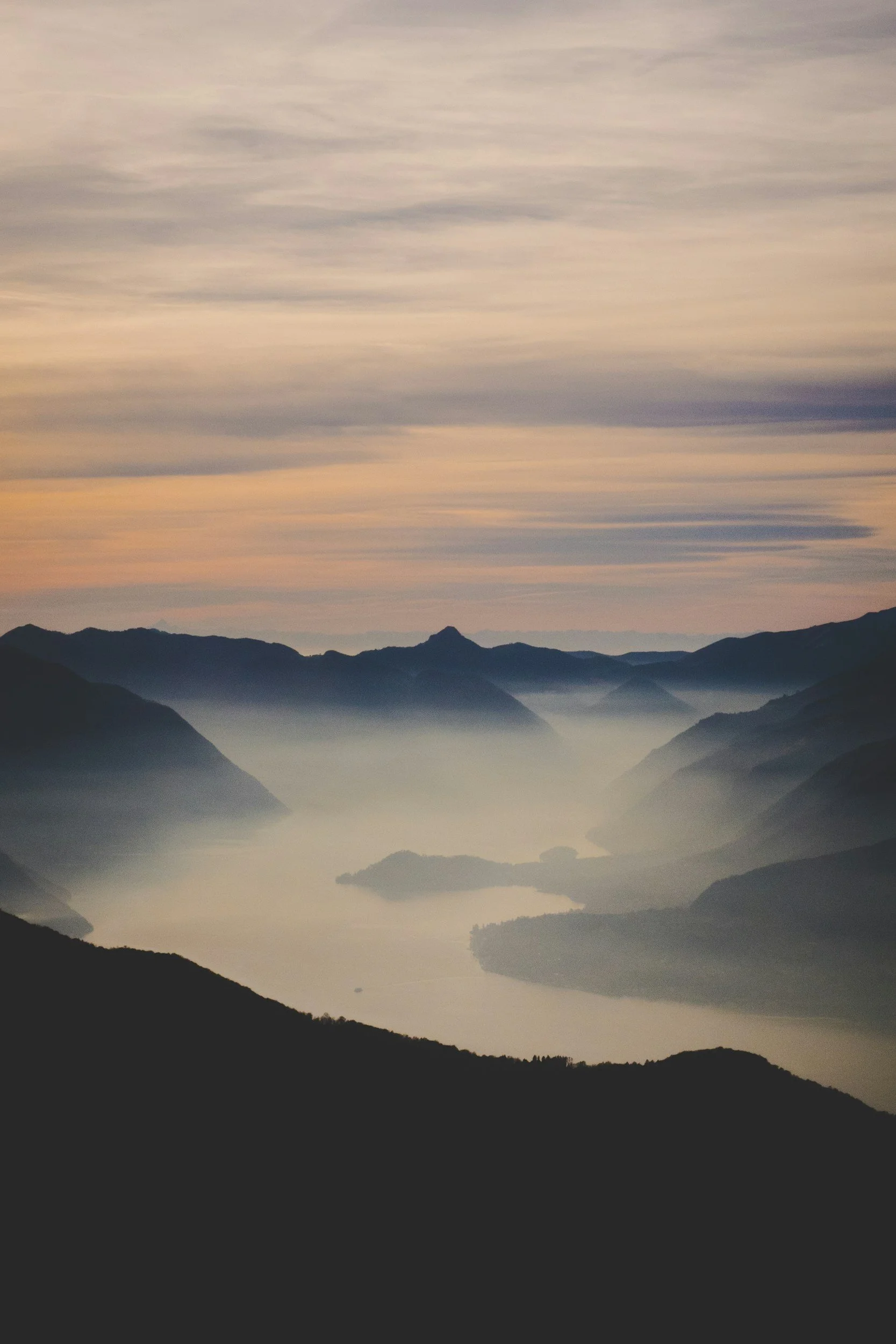 Decorative image of mountains with mist and sunrise