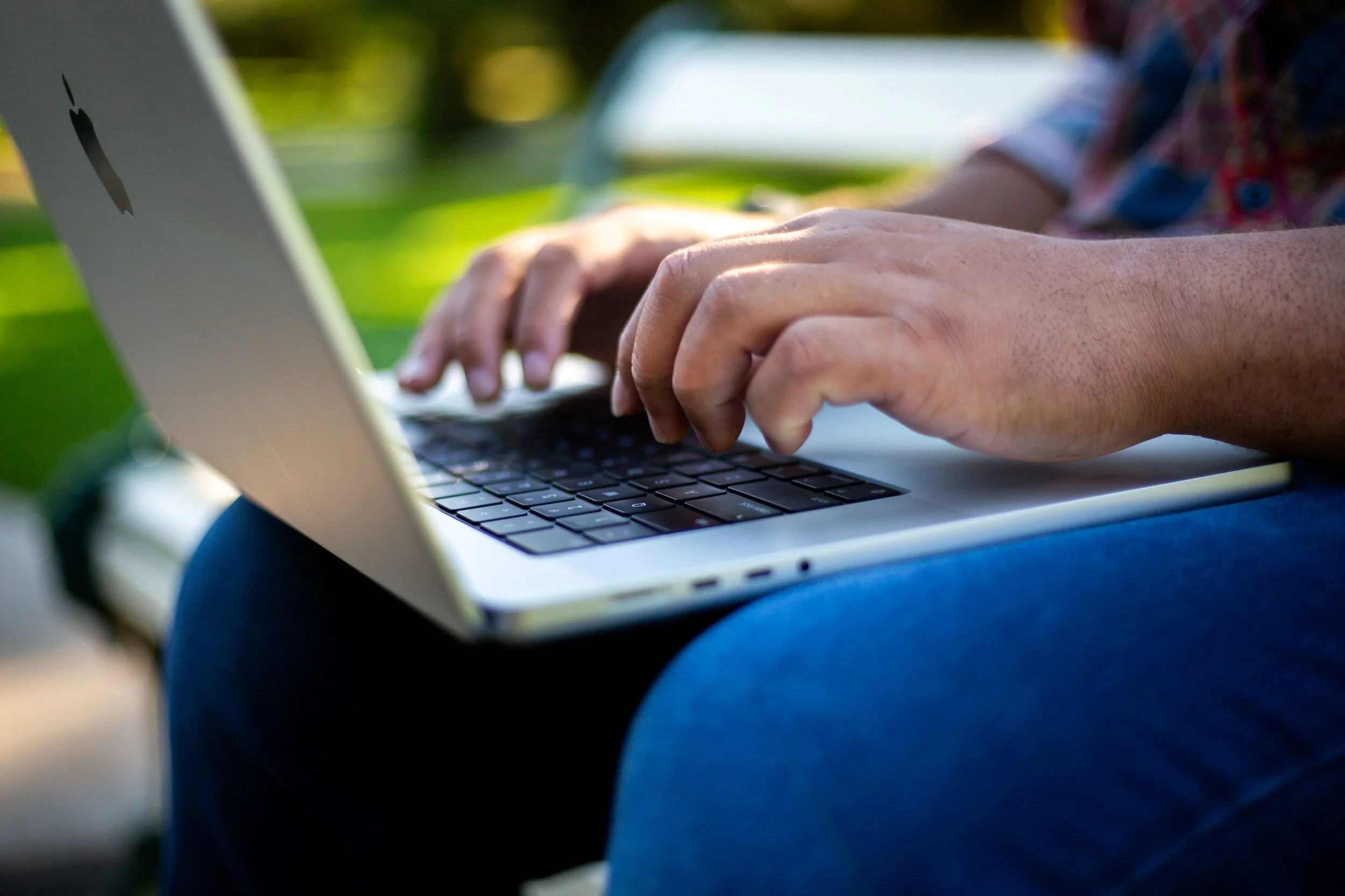 A person typing on a laptop.