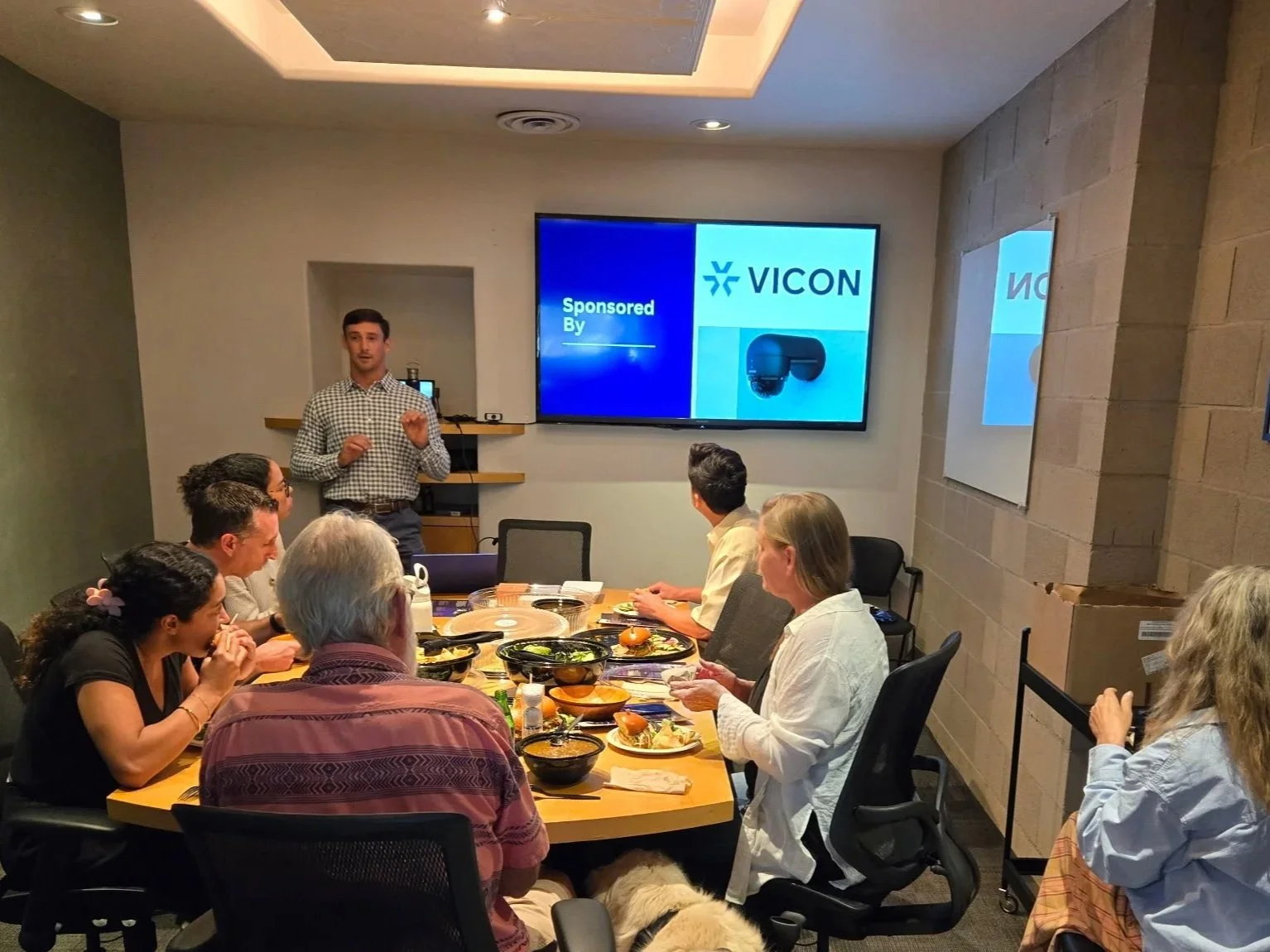 A Security Consultant presents during a lunch and learn at a small local firm