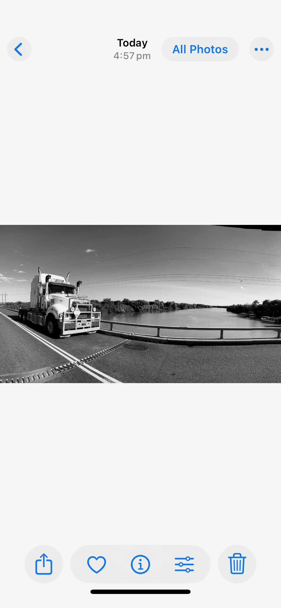 black and white truck on bridge